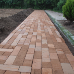 Descente de garage esthétique : Intégration de bordures décoratives et de revêtements contrastés pour mettre en valeur l'entrée de votre maison Duravel